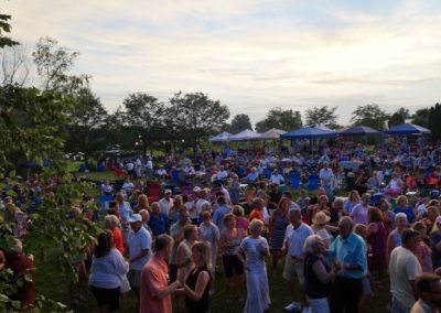 Experience the sense of community and camaraderie that fills the air at Equus Run Vineyards' summer concert series, as thousands of music lovers unite to celebrate their shared passion for big band performances.