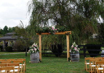 Discover the allure of our outdoor wedding venue, where blue skies, gentle breezes, and the rustle of leaves create a romantic ambiance for your perfect day.