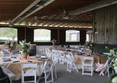 Bask in the radiant glow of the noon-day lighting as it floods our event barn, illuminating an enchanting indoor wedding celebration at Equus Run Vineyards. The abundant natural light creates a warm and inviting ambiance, showcasing the beauty of the venue's winery, vineyard, and distillery elements.